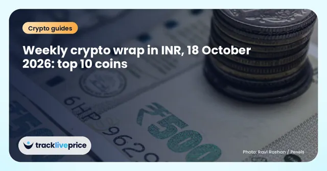A stack of Indian rupee notes on a wooden table