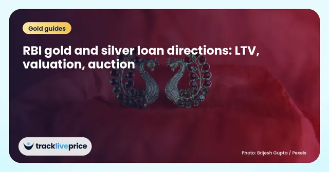 Gold earrings with red stones on red fabric, for a post on RBI rules for gold and silver loans